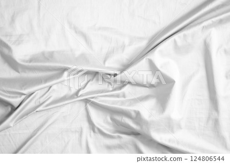 Abstract white wrinkled bedding sheet fabric texture background Abstract white wrinkled bedding sheet fabric texture background 124806544
