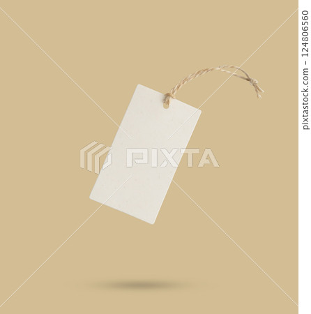 Blank price tag tied with string isolated on beige background 124806560