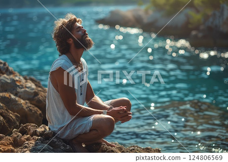 Meditation on the edge. Photo of a meditating human on the edge of a high cliff. Merging with the elements, the meditator finds harmony on the edge. Close-up view. Meditation on the edge. Photo of a meditating human on the edge of a high cliff. Merging with the elements, the meditator finds harmony on the edge. Close-up view. 124806569
