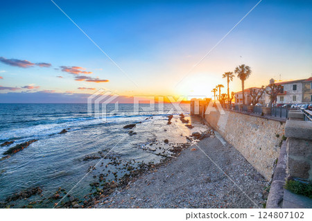 Amazing evening cityscape of historical part of Alghero town. 124807102