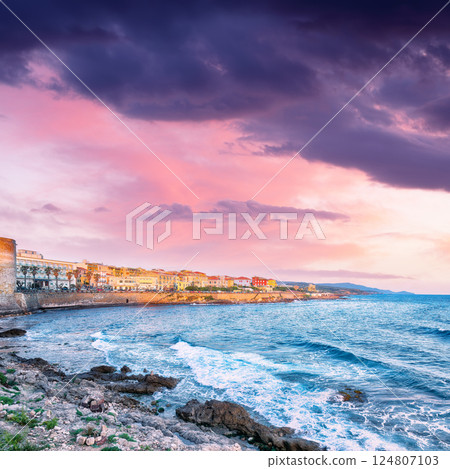 Amazing evening cityscape of historical part of Alghero town. 124807103