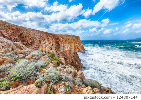 Attractive view of cliffs in valley Cala Domestica and storm on the sea Attractive view of cliffs in valley Cala Domestica and storm on the sea 124807144