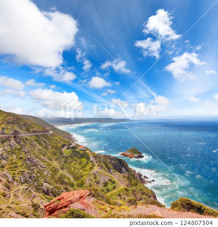 Attractive spring view of Nebida and Fontanamare coastline with Scoglio il Morto and turquoise sea. 124807304