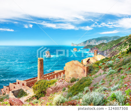 Attractive spring view of ancient ruins of Laveria Lamarmora (Miniera di Nebida). Attractive spring view of ancient ruins of Laveria Lamarmora (Miniera di Nebida). 124807308