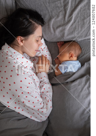 Newborn Baby Resting on mother tummy 124807682