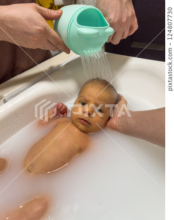 Newborn Baby Bathtime in little bath 124807730