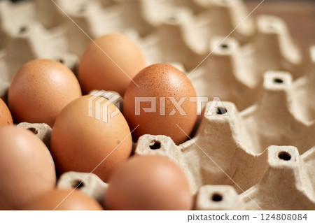 Close up brown eggs in egg box Close up brown eggs in egg box 124808084