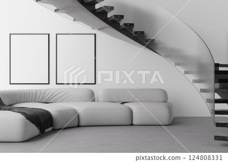 Modern living area features a sleek sofa in grey tones complemented by blank frames on the wall. This open space invites personalization and creativity with its minimalist design. 3D render. 124808331