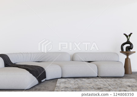 A contemporary interior showcases a spacious corner sofa and simple decor elements. The blank wall offers ample copy space ideal for displaying visual art or photographs. 3D render. 124808350