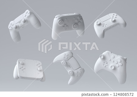 Set of flying gamer joysticks or gamepads on monochrome background 124808572