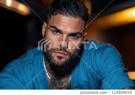 Intense portrait of a contemporary individual in vibrant atmosphere highlighting modern style and confidence 124809059