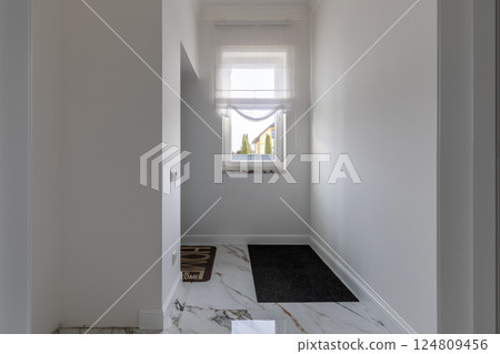 Minimalist Entryway with Marble Flooring and Window 124809456