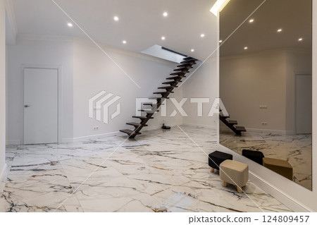 Luxury Interior with Floating Staircase and Marble Floor 124809457