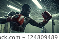 Boxer Training with Heavy Punches on Punching Bag 124809489