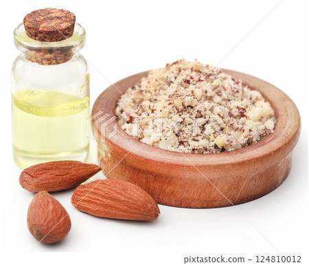 Crushed with peeled almond with oil in a bottle 124810012