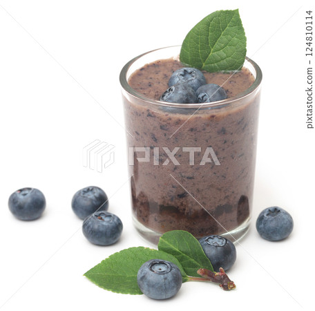 Fresh blueberries and juice in a glass 124810114