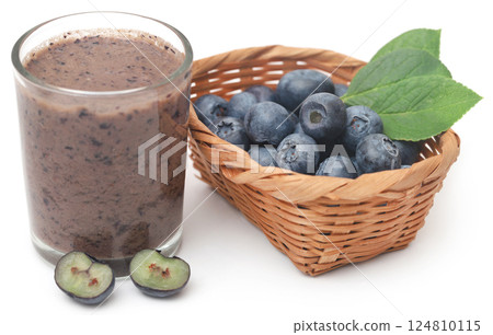 Fresh blueberries and juice in a glass Fresh blueberries and juice in a glass 124810115