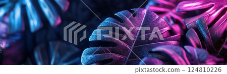 Lush jungle leaves are beautifully illuminated by soft electric blue and magenta neon light, creating a moody and cinematic environment perfect for text placement 124810226