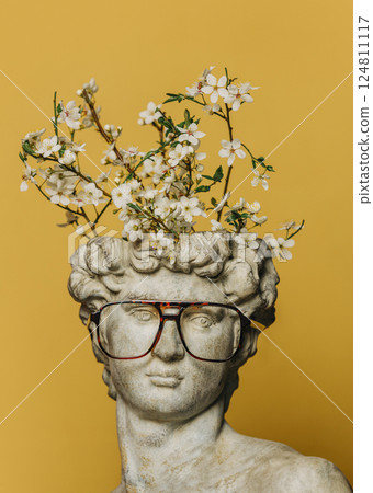 Antique bust with a blooming tree branch growing from his head 124811117
