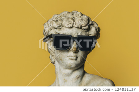 antique statue of a young man wearing sunglasses on a yellow background 124811137