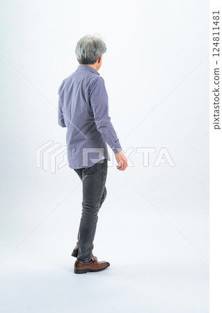 Full-body photo of a walking senior man from behind 124811481