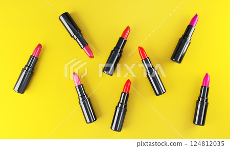 Top view of lipsticks on bright backdrop. 124812035