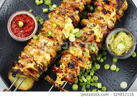 Delicious kebab of bacon and potatoes. 124812138