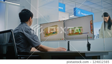 Female TSA Worker Controlling X-ray Scanning of Baggage. Diverse Passengers During Screening Procedure Female TSA Worker Controlling X-ray Scanning of Baggage. Diverse Passengers During Screening Procedure 124812385