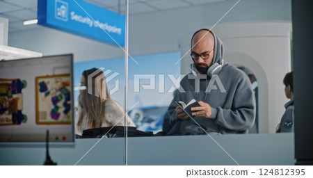 Diverse People with Suitcases During Screening. Screen with X-ray Images of Luggage Scanning Diverse People with Suitcases During Screening. Screen with X-ray Images of Luggage Scanning 124812395