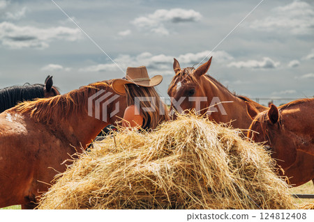 Cowboy woman with long hair with horse at exhibition 124812408