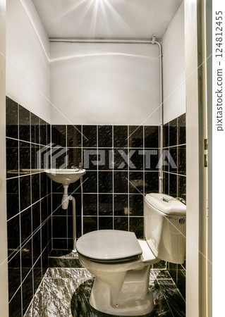 A contemporary bathroom showcasing sleek tiles and minimalist fixtures, designed for comfort and style. The space offers functional beauty and a fresh aesthetic. A contemporary bathroom showcasing sleek tiles and minimalist fixtures, designed for comfort and style. The space offers functional beauty and a fresh aesthetic. 124812455
