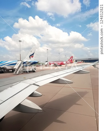 BANGKOK, THAILAND, February 25, 2025. View from airplane on busy Suvarnabhumi airport in Bangkok, Thailand BANGKOK, THAILAND, February 25, 2025. View from airplane on busy Suvarnabhumi airport in Bangkok, Thailand 124812821
