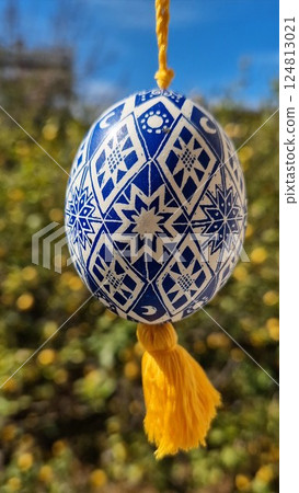 Ukrainian pysanka featuring traditional Easter eggs with intricate blue and white patterns showcasing folk art and cultural heritage for a vibrant celebration Ukrainian pysanka featuring traditional Easter eggs with intricate blue and white patterns showcasing folk art and cultural heritage for a vibrant celebration 124813021
