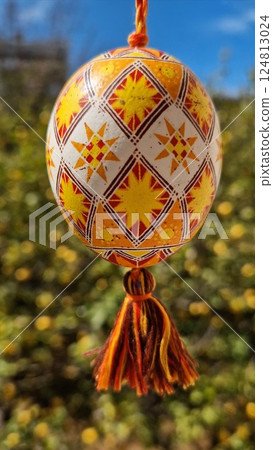 Celebrating traditional Easter with beautiful Ukrainian pysanka featuring intricate patterns and vibrant colors of Easter eggs Celebrating traditional Easter with beautiful Ukrainian pysanka featuring intricate patterns and vibrant colors of Easter eggs 124813024