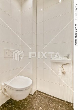 A sleek and modern bathroom showcasing minimalist design with clean lines, white tiles, and subtle lighting, ideal for contemporary homes. A sleek and modern bathroom showcasing minimalist design with clean lines, white tiles, and subtle lighting, ideal for contemporary homes. 124813267