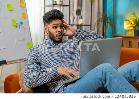 Frustrated business man having software problems with laptop error or mistake virus notification Frustrated business man having software problems with laptop error or mistake virus notification 124813929