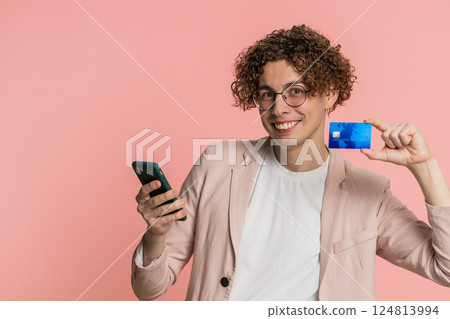 Man use credit bank card smartphone while transferring spending money, purchases online shopping Man use credit bank card smartphone while transferring spending money, purchases online shopping 124813994