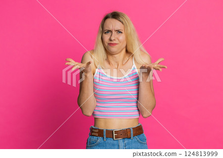 Upset frustrated annoyed woman expressing disbelief irritation negative emotion quarrel stress 124813999