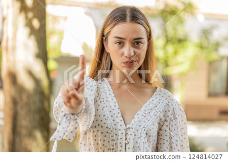Woman reacting to unpleasant awful idea, dissatisfied with bad quality, wave hand, shake finger No Woman reacting to unpleasant awful idea, dissatisfied with bad quality, wave hand, shake finger No 124814027