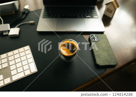 Coffee shot in a glass on the desk Coffee shot in a glass on the desk 124814286