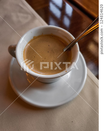 Cup of coffee Lungo sitting on table in prague restaurant Cup of coffee Lungo sitting on table in prague restaurant 124814620