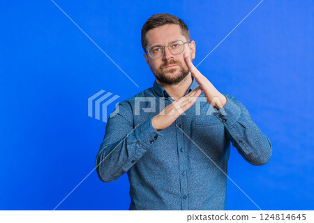 Tired upset man showing pause gesture, limit or stop sign, time out, take a break relax, rest Tired upset man showing pause gesture, limit or stop sign, time out, take a break relax, rest 124814645