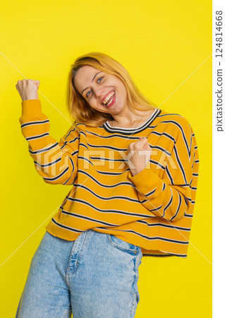 Happy Caucasian woman celebrate success winning birthday lottery jackpot goal achievement good news 124814668
