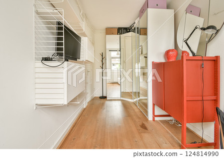 A stylish and bright interior hallway featuring contemporary furniture and decor elements, showcasing a blend of functionality and aesthetics. 124814990