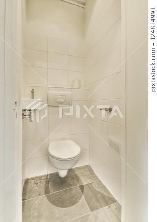 A sleek and modern bathroom featuring minimalistic elements, clean lines, and a simple color palette for a serene experience. A sleek and modern bathroom featuring minimalistic elements, clean lines, and a simple color palette for a serene experience. 124814991