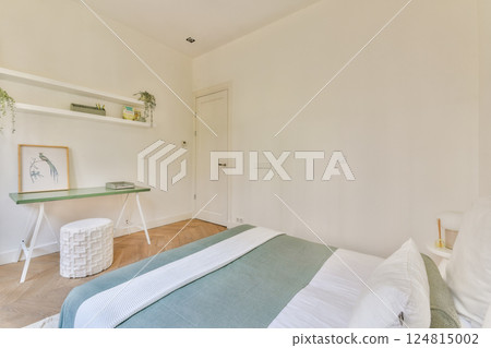 A spacious and well-lit bedroom featuring a minimalist design, soft color palettes, and stylish decor elements that create a serene atmosphere. A spacious and well-lit bedroom featuring a minimalist design, soft color palettes, and stylish decor elements that create a serene atmosphere. 124815002