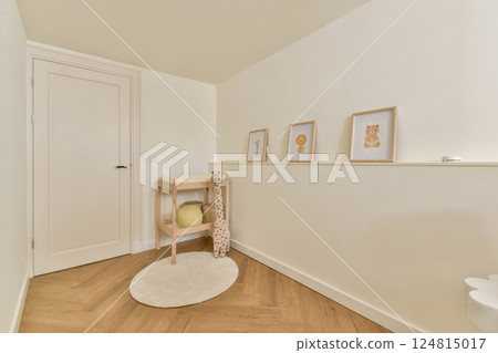 A serene and welcoming hallway featuring soft wood flooring, simple decor, and charming framed artworks that evoke a warm, minimalist aesthetic. A serene and welcoming hallway featuring soft wood flooring, simple decor, and charming framed artworks that evoke a warm, minimalist aesthetic. 124815017