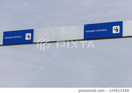 Sign in three languages Danish, English and German - Border control. 124815389