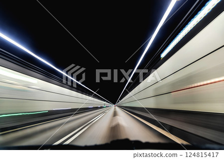 High-speed road tunnel view from a fast-moving car. High-speed road tunnel view from a fast-moving car. 124815417