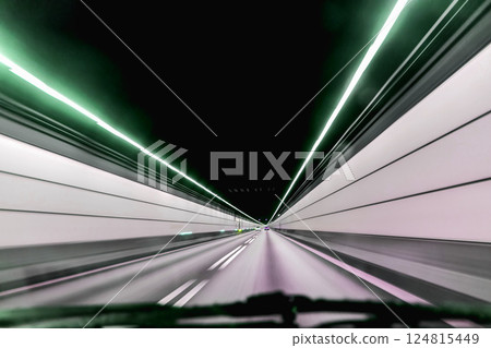 High-speed road tunnel view from a fast-moving car. 124815449
